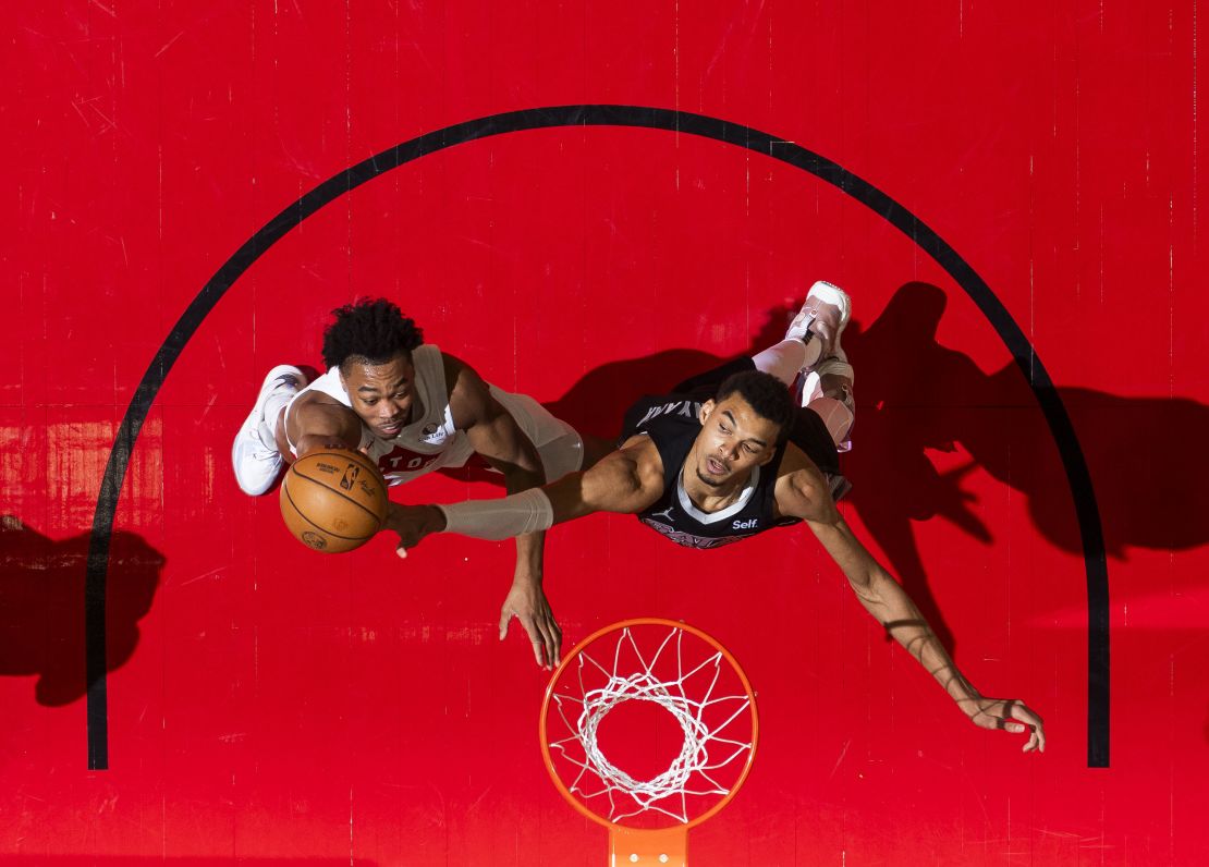 Wembanyama denies Toronto's Scottie Barnes at the rim during the game.