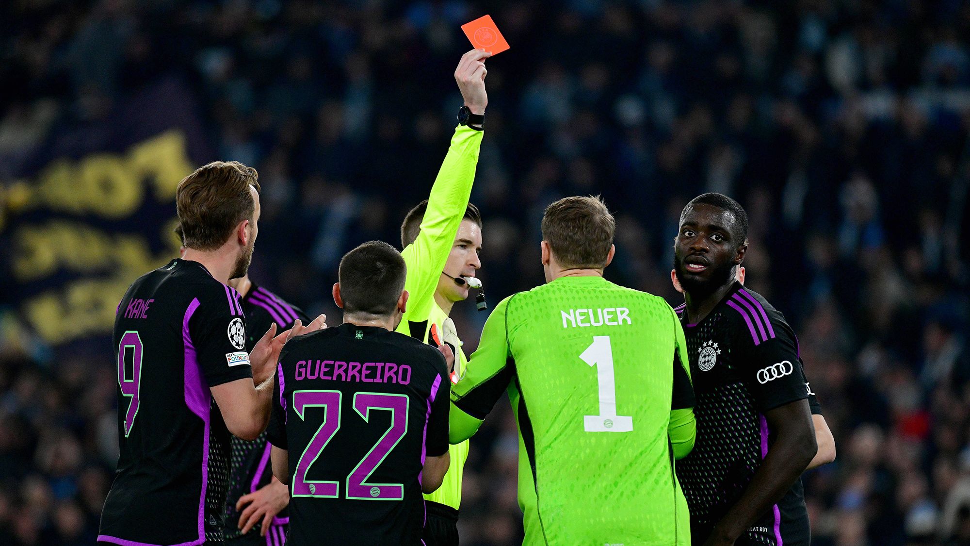 Upamecano (right) is shown a red card against Lazio.