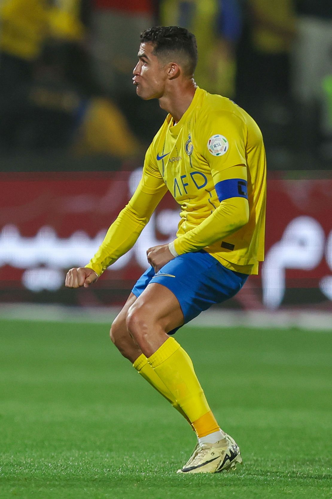 Ronaldo gestures towards the Al-Shabab fans.