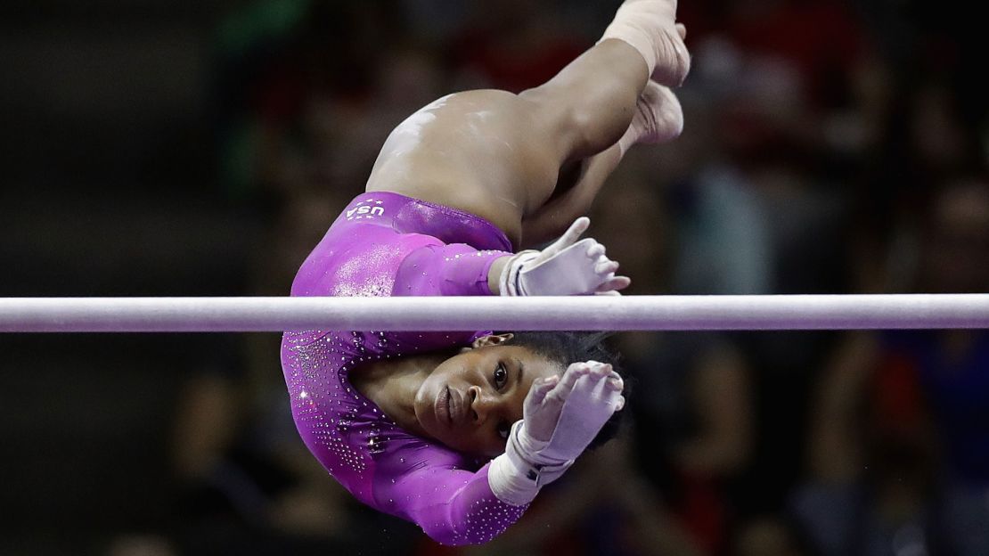 Douglas competes on the uneven bars during the 2016 US Olympic team trials.