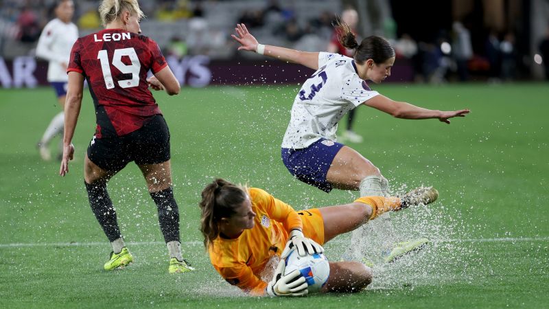 Waterlogged pitch causes controversy as US women’s team beats Canada in penalty shootout to reach W Gold Cup final