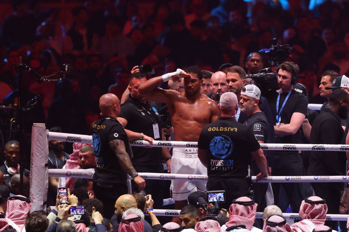 Joshua celebrates after defeating Ngannou.