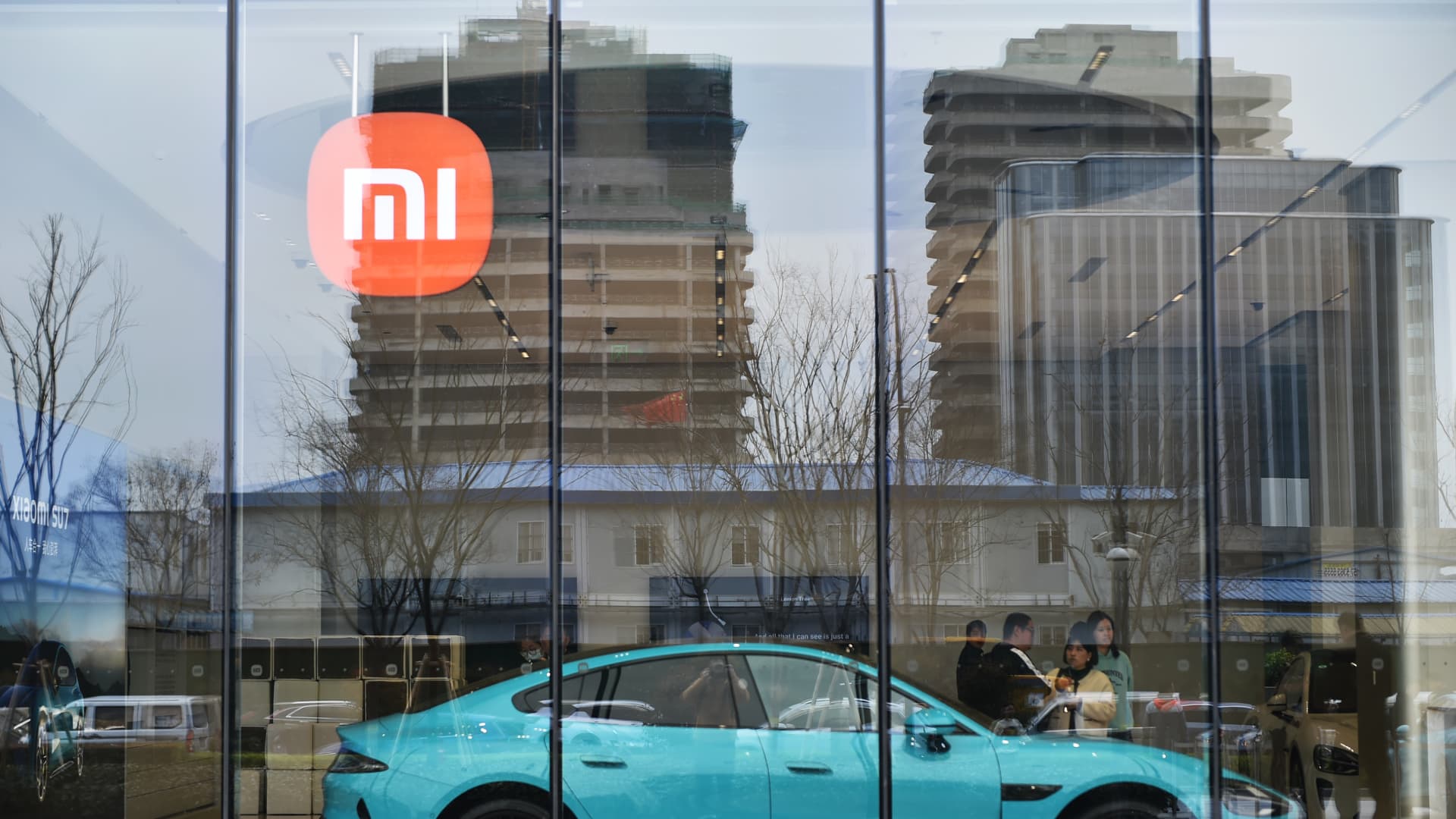 Xiaomi shares pop 16% after the Chinese smartphone maker launches its first EV