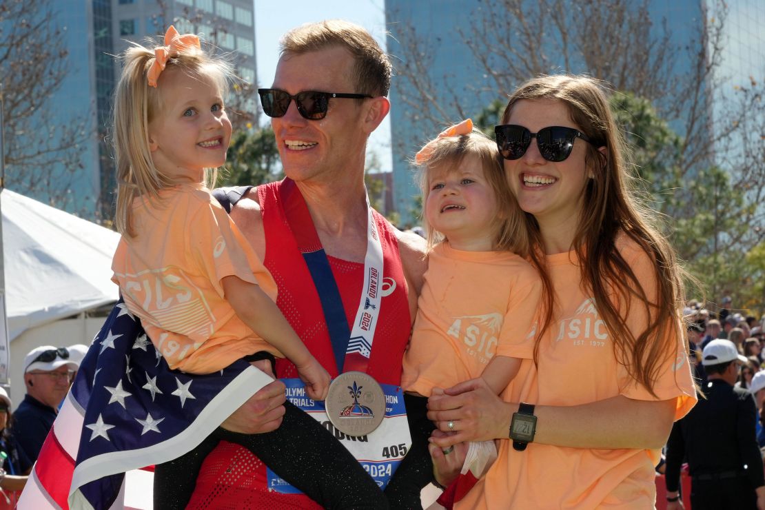 Young poses with his family after achieving his dream of making the Olympic team.