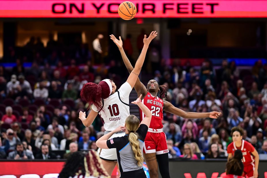 Kamilla Cardoso of the South Carolina Gamecocks and Saniya Rivers jump for the opening tipoff.