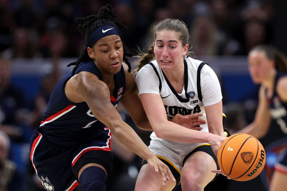 Martin and Arnold #2 of the UConn Huskies fight for the ball.