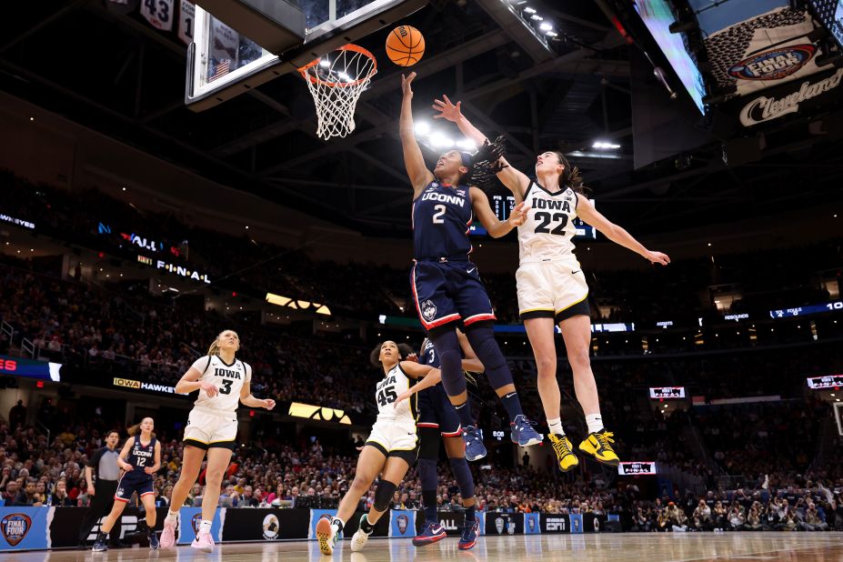 UConn's KK Arnold shoots the ball over Clark.