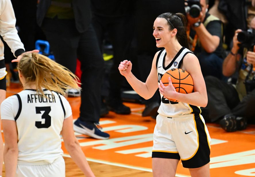 Iowa's Caitlin Clark celebrates after the game. Clark finished with 21 points, nine rebounds and seven assists.