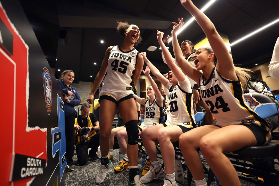 The Iowa Hawkeyes celebrate after beating the UConn Huskies 71-69 in a Final Four semifinal game at Rocket Mortgage Fieldhouse on Friday, April 5, in Cleveland.