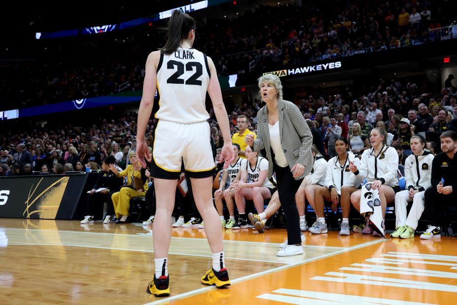 Clark listens to Iowa coach Lisa Bluder during the second half.