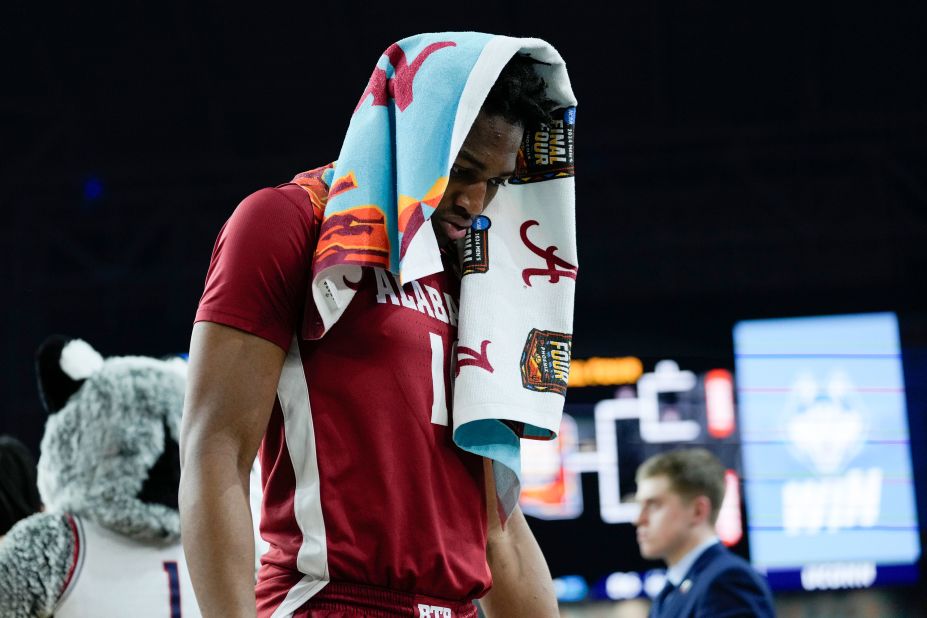 Alabama forward Mouhamed Dioubate walks off the court after losing to UConn.