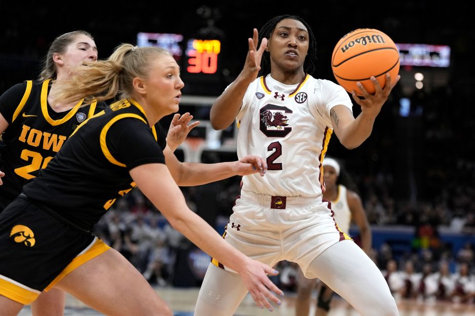 South Carolina forward Watkins fights for a rebound with Iowa guard Sydney Affolter, left.