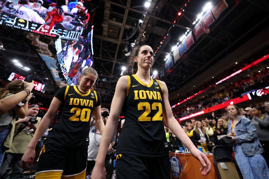 Clark, right, and Kate Martin walk off the court after losing to South Carolina.