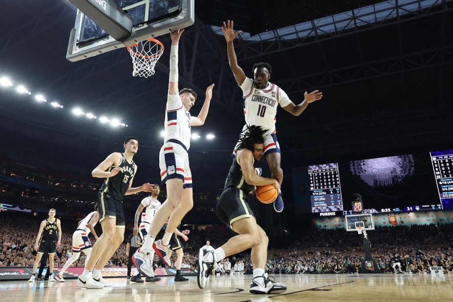 UConn's Hassan Diarra leaps above Purdue's Trey Kaufman-Renn.