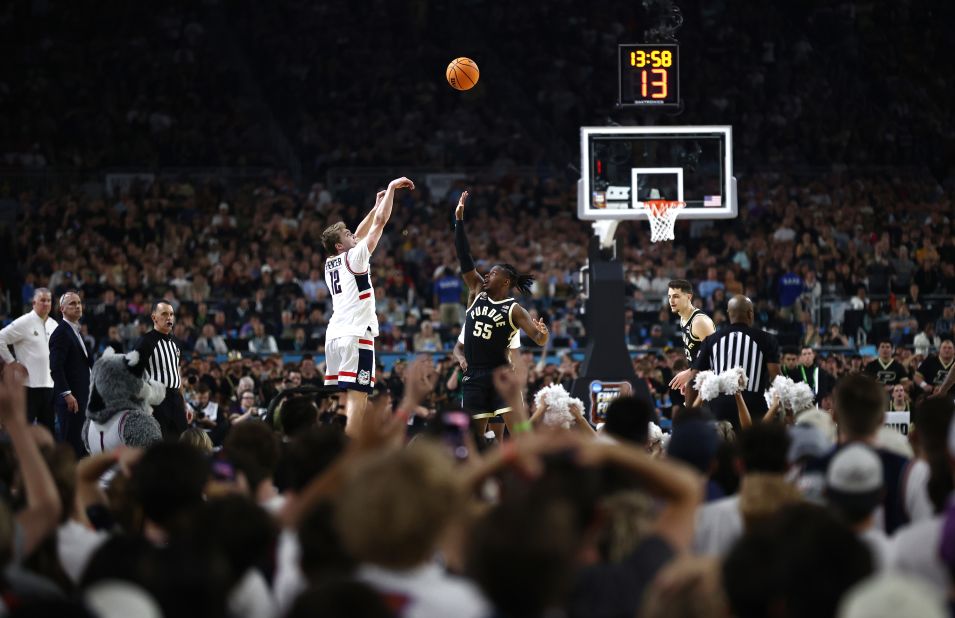 UConn's Cam Spencer shoots the ball over Purdue's Lance Jones.