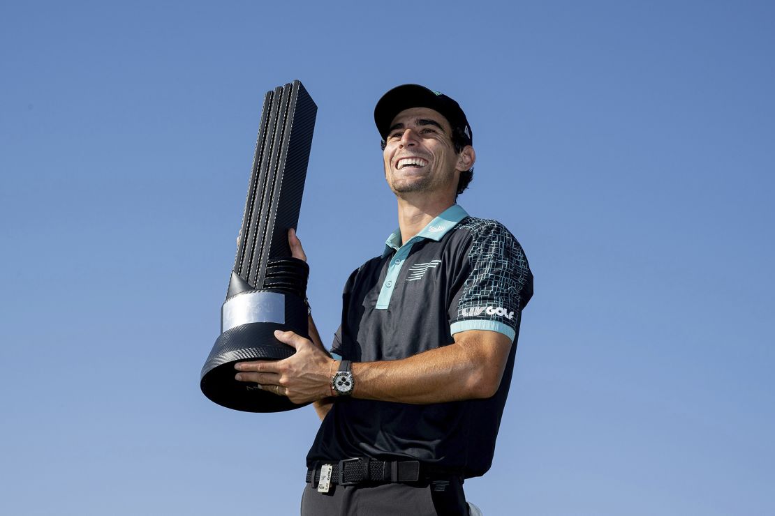 Niemann poses with the winner's trophy.