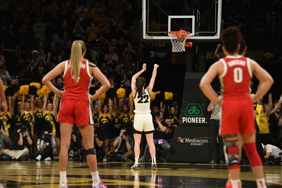 Iowa guard Caitlin Clark broke the scoring record with a pair of free throws at the end of the first half.