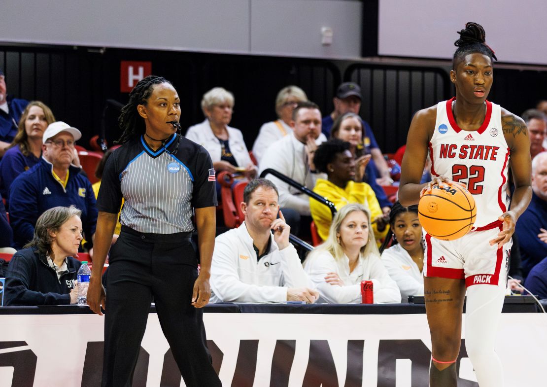 Tommi Paris (left) watches as NC State's Saniya Rivers handles the ball during the first half the game against Chattanooga.