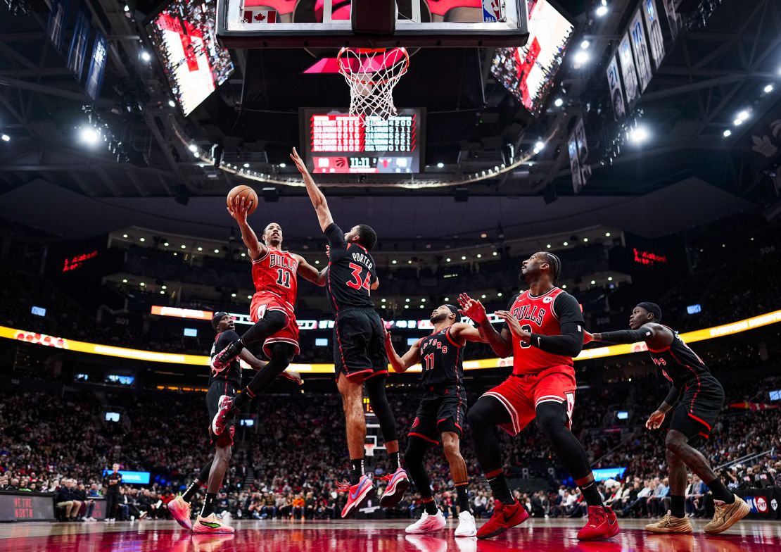 Jontay Porter pictured defending DeMar DeRozan of the Chicago Bulls as he goes to the basket.