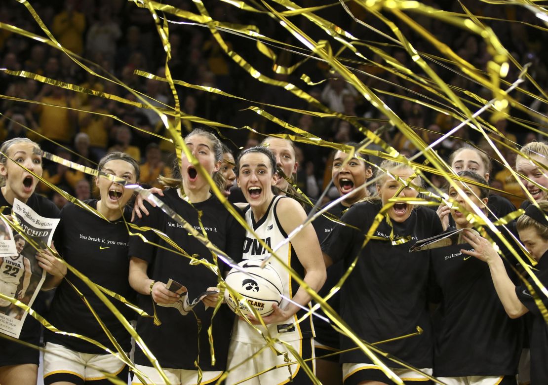 Clark celebrates with her teammates after breaking the NCAA women's all-time scoring record in February.