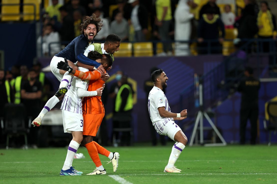 Al Ain players celebrate their dramatic victory.