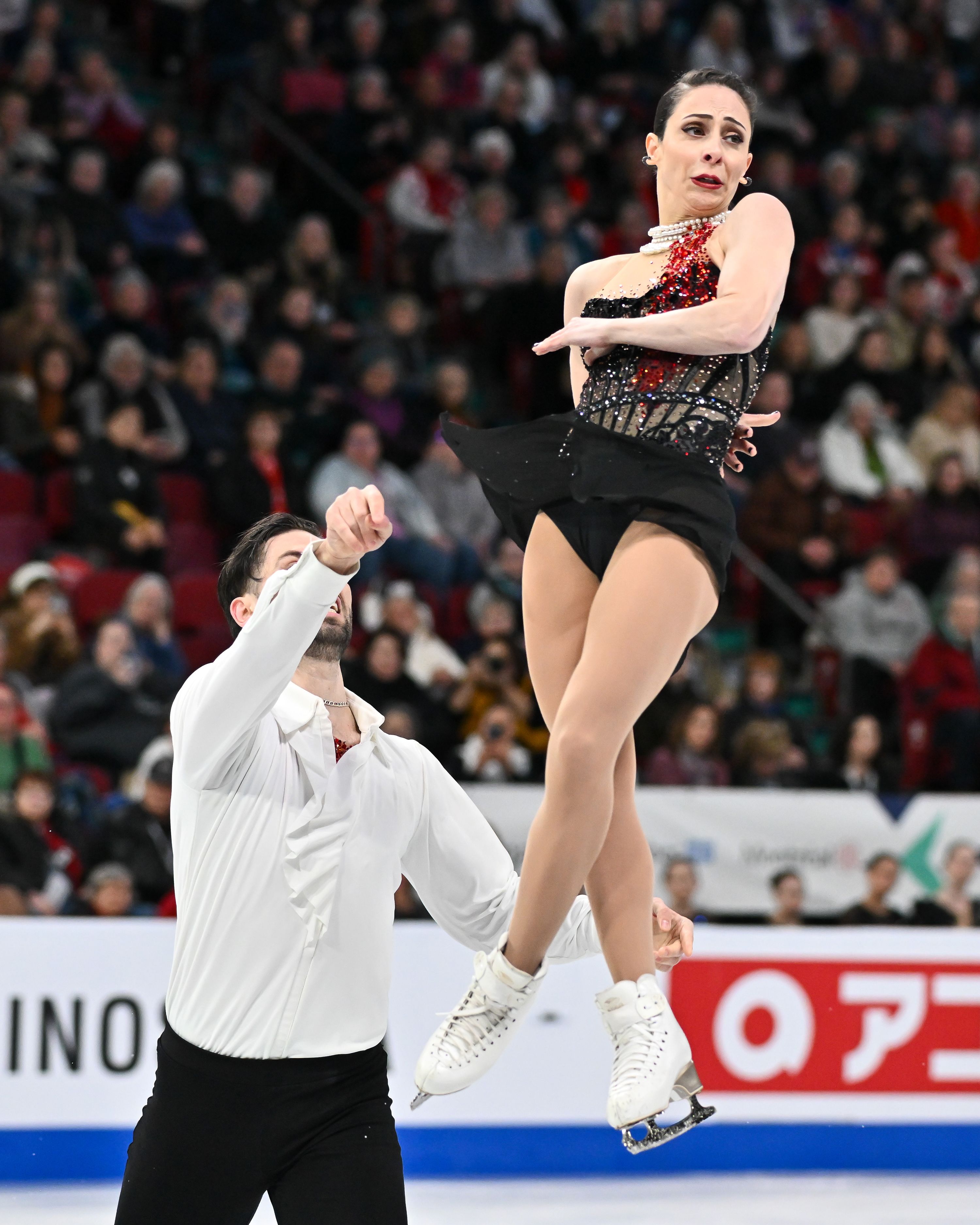 Deschamps and Stellato-Dudek perform a throw triple jump during the 2024 world championships. They skated to music from "Interview with the Vampire," hence the blood-stain designs in their costumes.