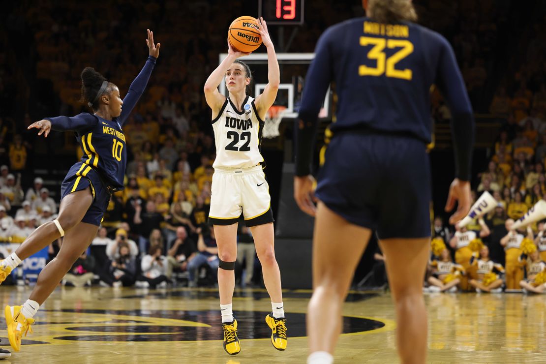 Clark shoots as West Virginia's Jordan Harrison, No. 10, defends during Monday's second-round NCAA tournament game.