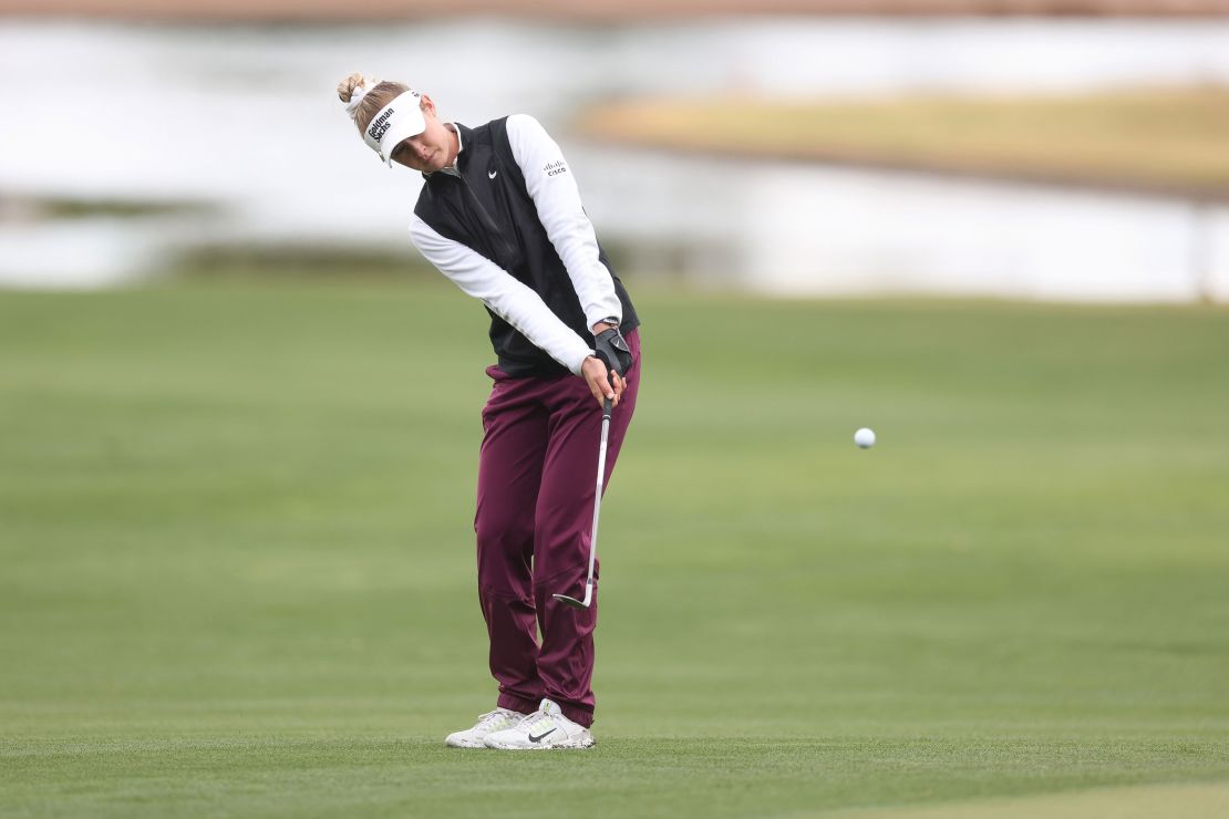 Nelly Korda chips on the 18th green.