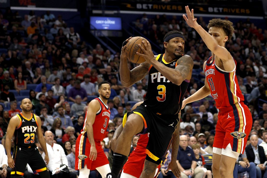 NEW ORLEANS, LOUISIANA - APRIL 01: Bradley Beal #3 of the Phoenix Suns passes the ball around Dyson Daniels #11 of the New Orleans Pelicans during the fourth quarter of an NBA game at Smoothie King Center on April 01, 2024 in New Orleans, Louisiana. NOTE TO USER: User expressly acknowledges and agrees that, by downloading and or using this photograph, User is consenting to the terms and conditions of the Getty Images License Agreement. (Photo by Sean Gardner/Getty Images)