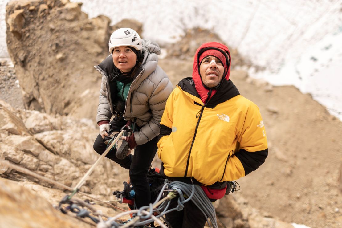 Climbers Alex Honnold, right, and Hazel Findlay assess the route ahead as they ascend Pool Wall, one of the stops before Ingmikortilaq, in Eastern Greenland.