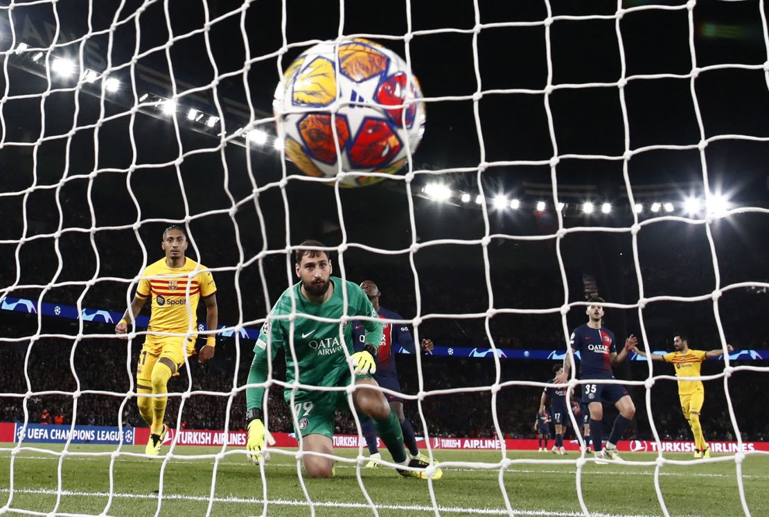 Raphinha (L) scores his and Barcelona's second goal of the game.