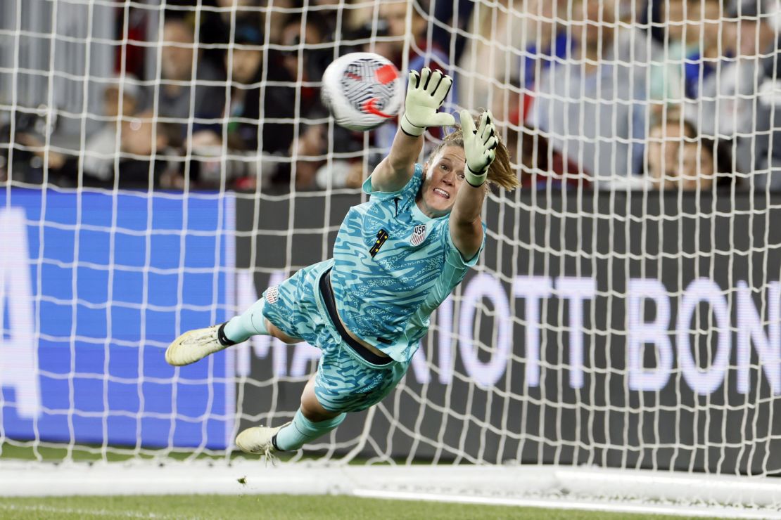 Alyssa Naeher makes a save during the shootout.