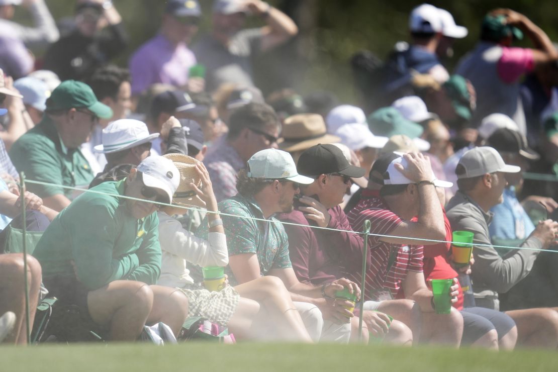 Sand whipped out from bunkers was a problem for players and fans alike.