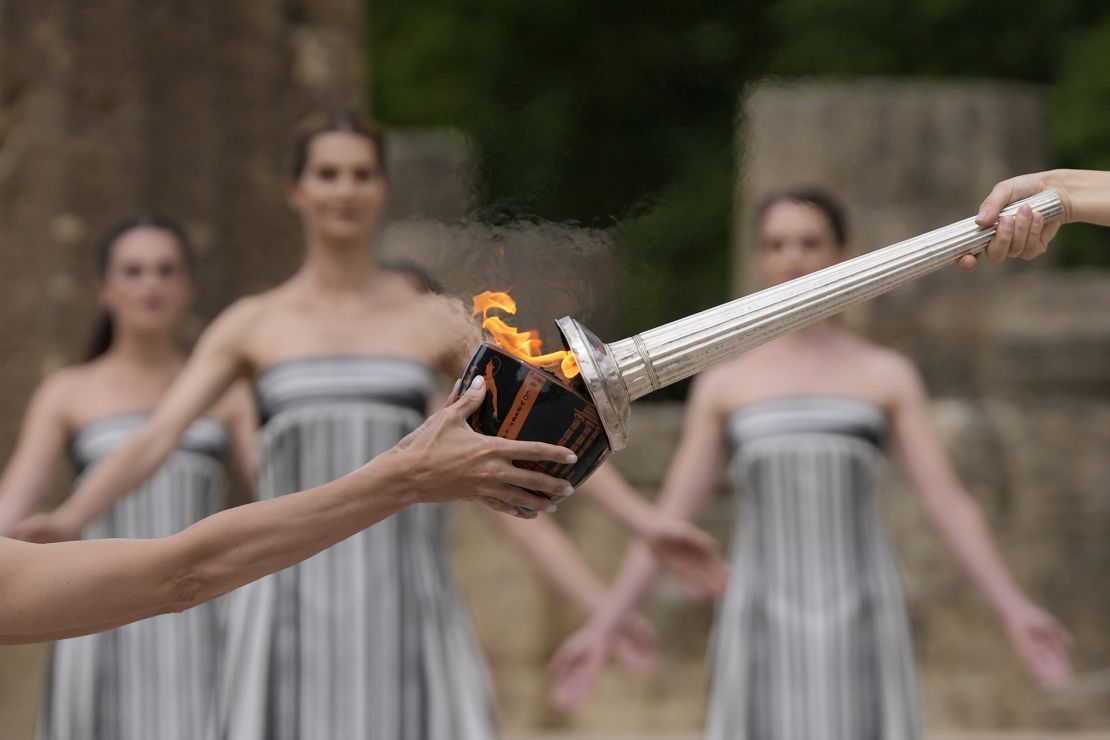 The flame will be carried through Greece for 11 days before being handed over to Paris organizers on April 26.