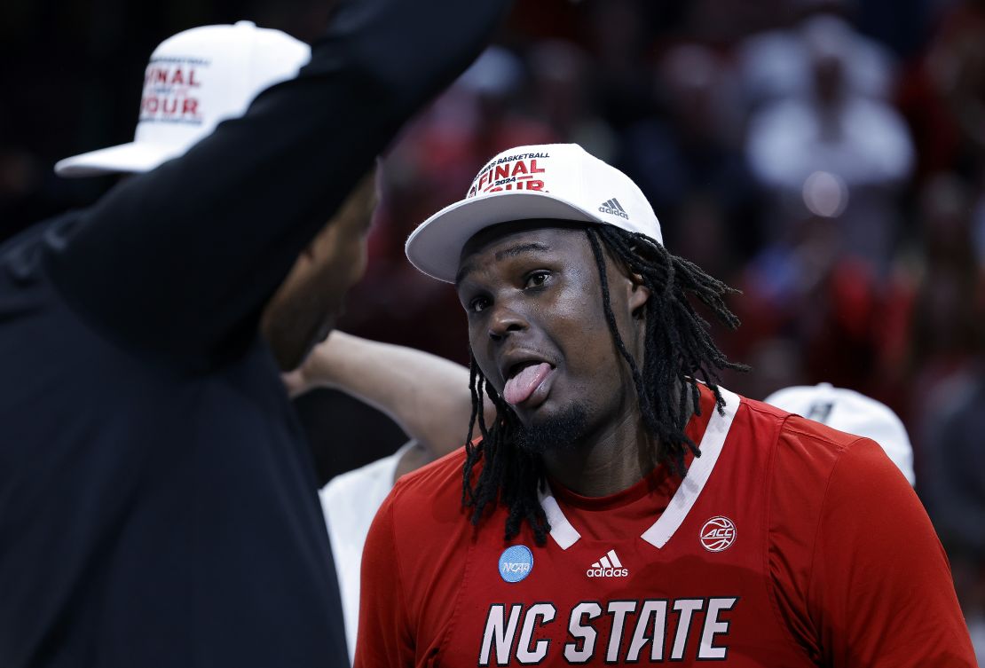 DALLAS, TEXAS - MARCH 31: DJ Burns Jr. #30 of the North Carolina State Wolfpack celebrates after the Wolfpack defeated the Duke Blue Devils to advance to the Final Four after the Elite 8 round of the NCAA Men's Basketball Tournament at American Airlines Center on March 31, 2024 in Dallas, Texas. (Photo by Carmen Mandato/Getty Images)