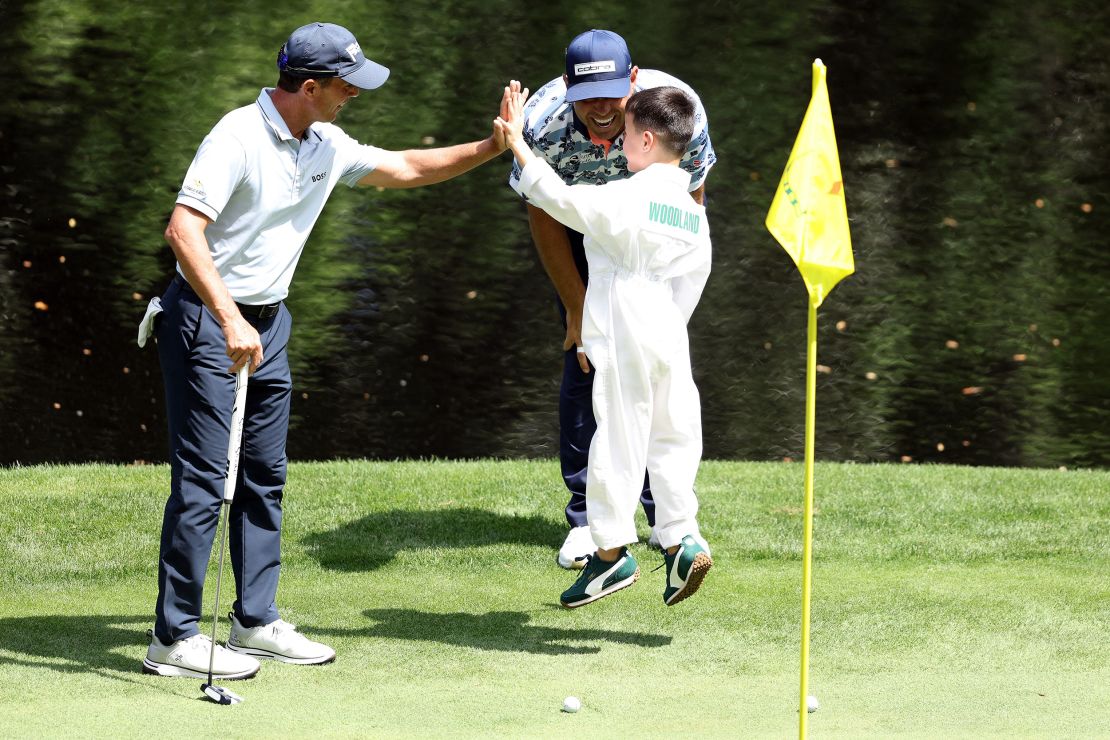 Jax Woodland is congratulated on his putt.