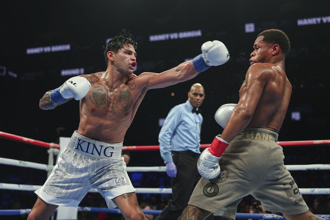 Garcia throws a punch at Haney.