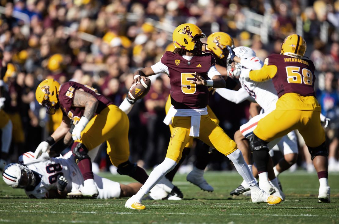 Rashada throws a pass against the Arizona Wildcats.