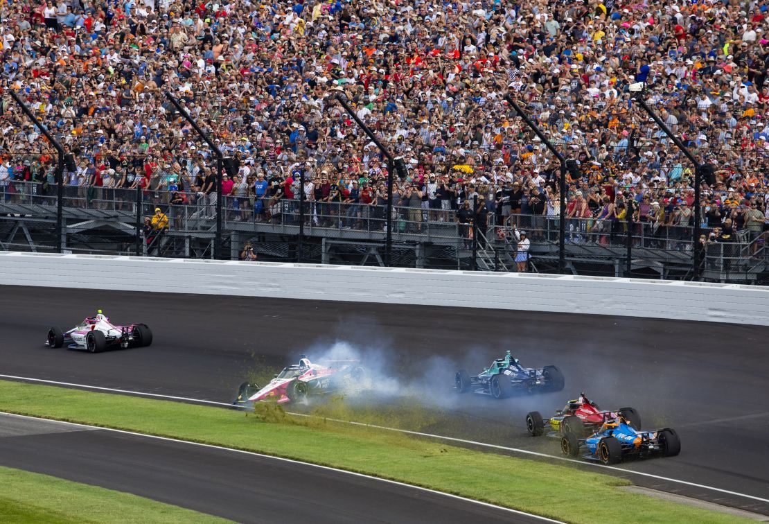 Indycar Series driver Tom Blomqvist (66) crashes on the the first lap of the race.