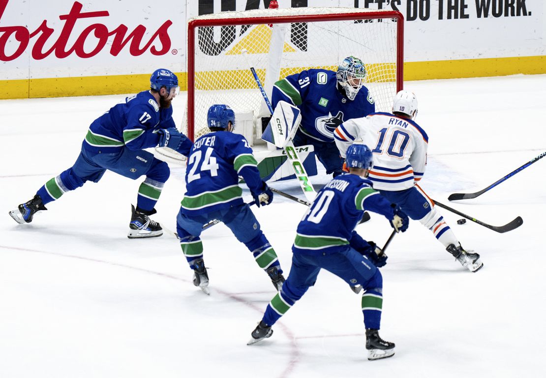 The Oilers' Derek Ryan attempts a shot against Arturs Silovs during the game.