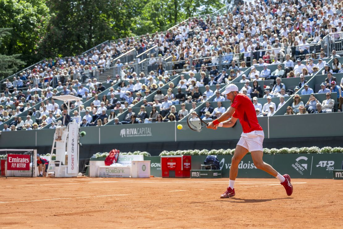 Djokovic returns a ball to Machac during the Geneva Open semifinal.