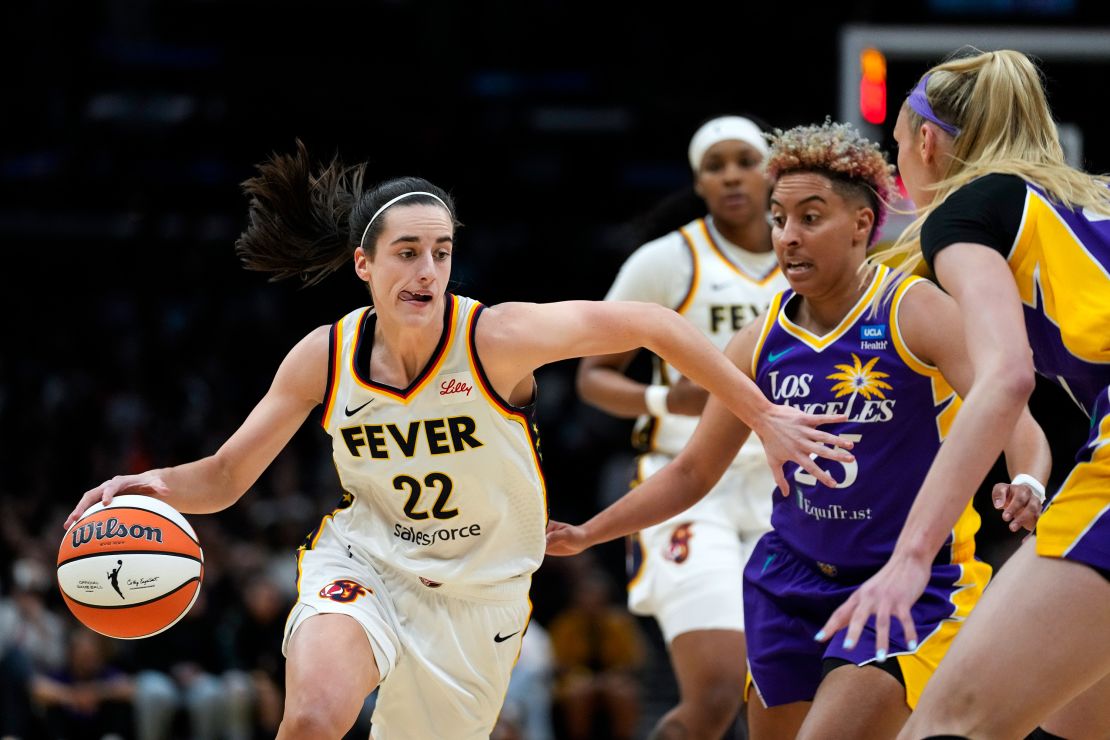 Clark controls the ball against Sparks guard Layshia Clarendon.