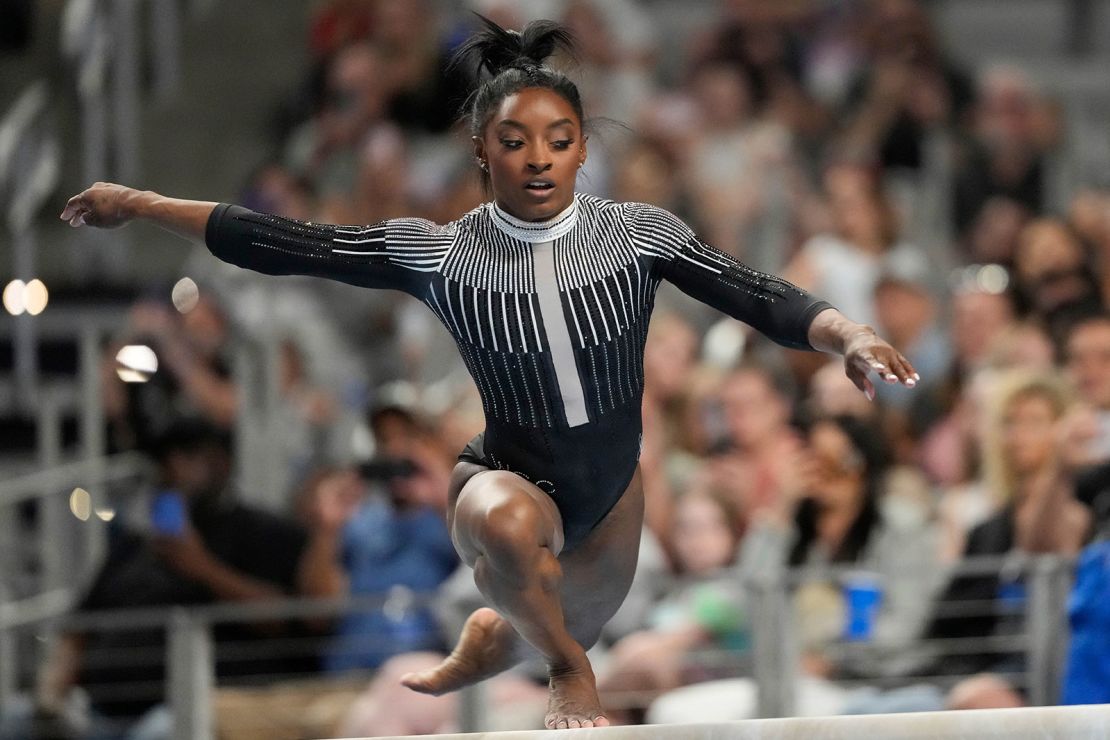 Simone Biles competes on the beam Friday in Fort Worth, Texas.