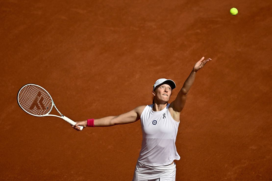 Świątek serves against Karolína Muchová during last year's final at Roland Garros.