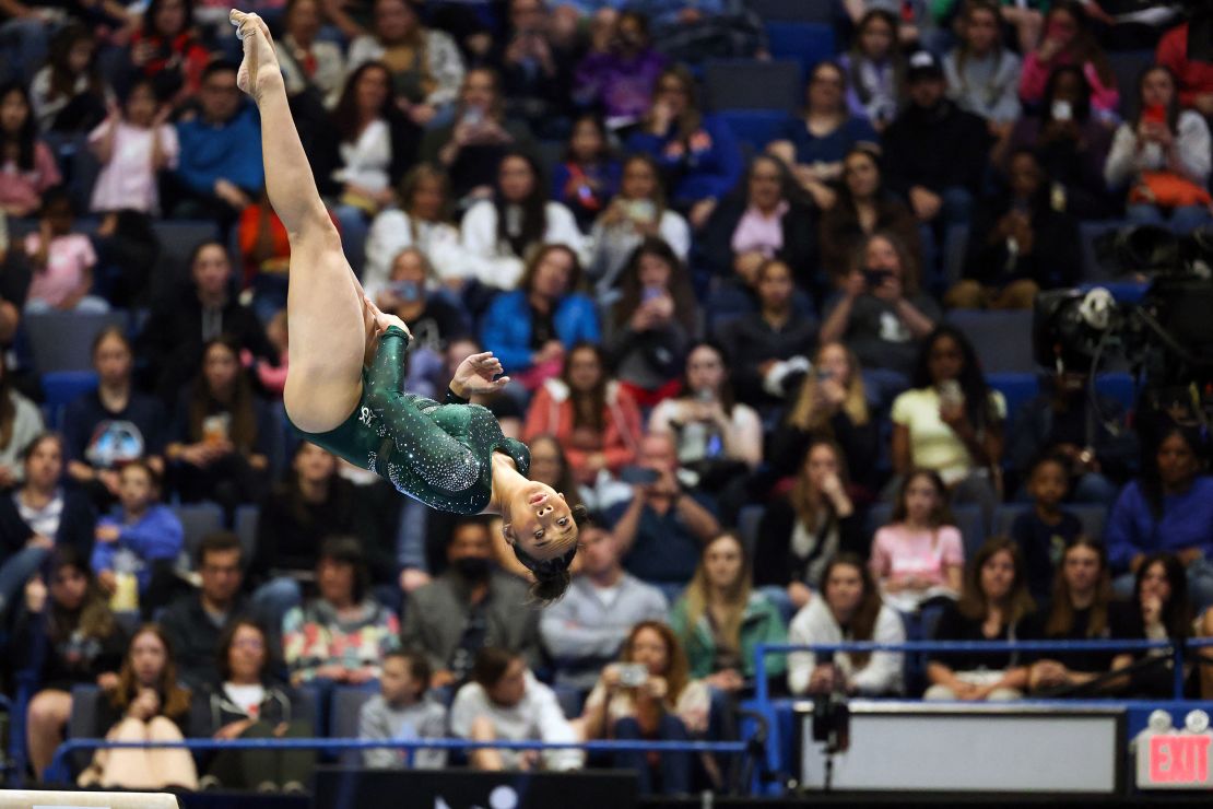 Suni Lee competes in the balance beam at the Core Hydration Classic.