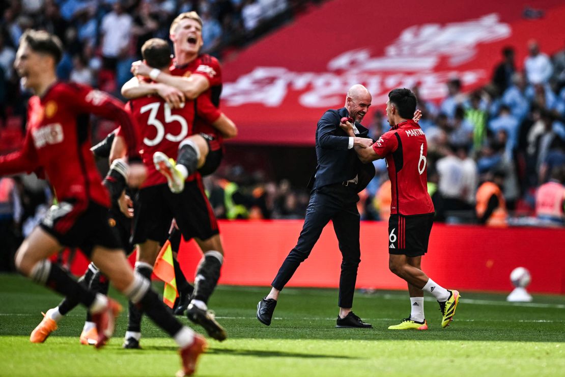 Erik ten Hag celebrates with his players after winning the FA Cup.