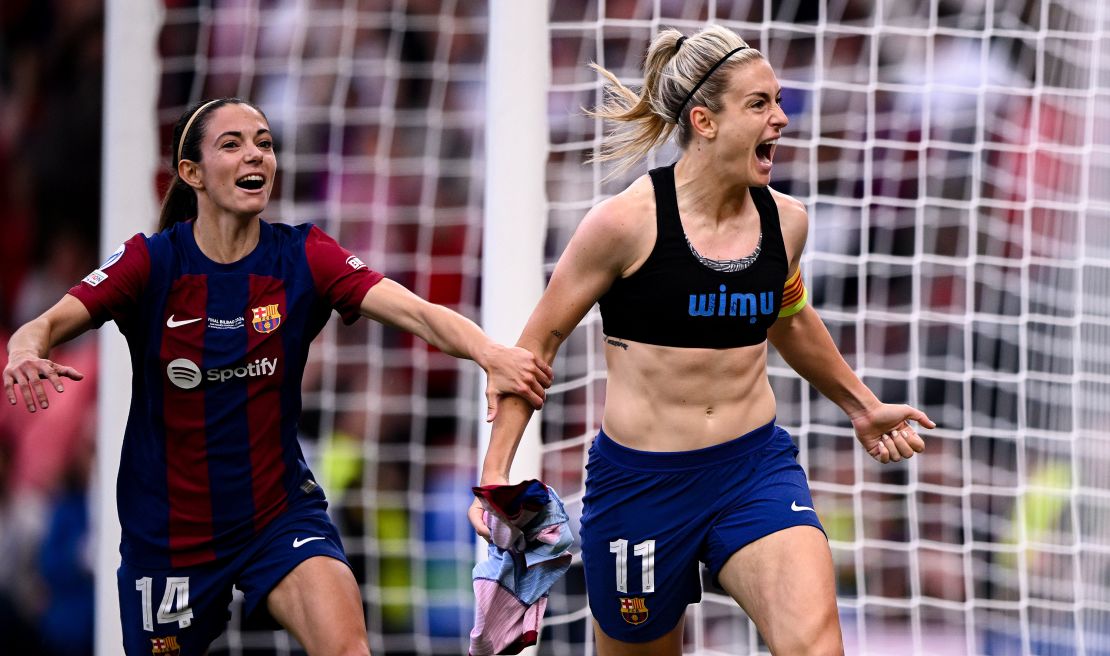 Putellas (right) celebrates scoring Barcelona's second goal against Lyon.