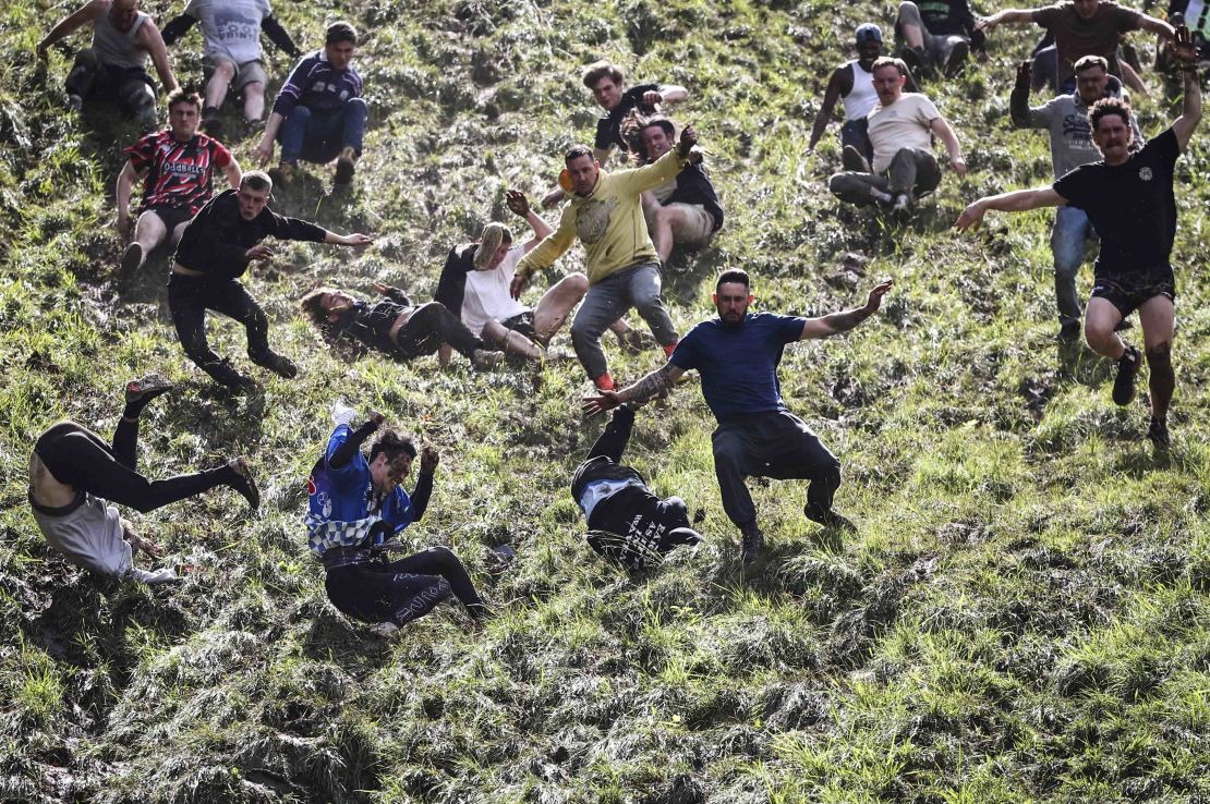 Chaotic scenes as competitors come tumbling down the hill during the annual Cooper's Hill cheese-rolling competition.