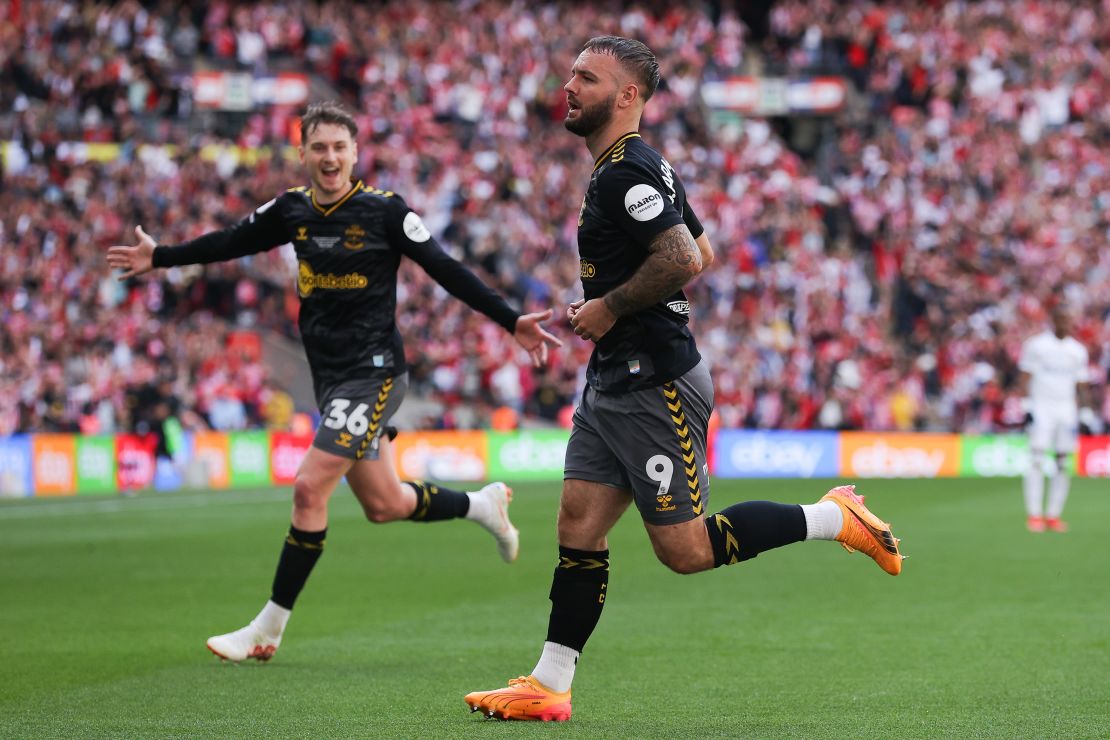 Adam Armstrong celebrates after scoring the opening goal of the 2024 Championship play-off final against Leeds.