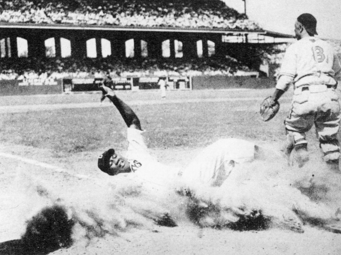 Josh Gibson slides home safely during the 1944 Negro Leagues East-West All-Star Game at Comiskey Park in Chicago.